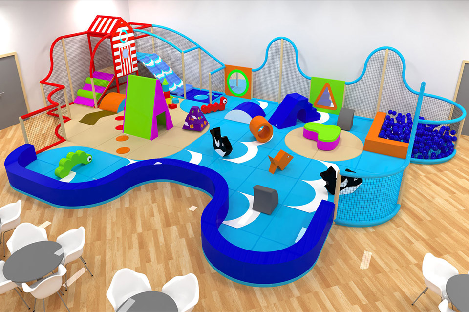 Indoor play area featuring colourful soft play equipment, including slides, climbing structures, and interactive shapes set in a blue wave pattern on a wooden floor.