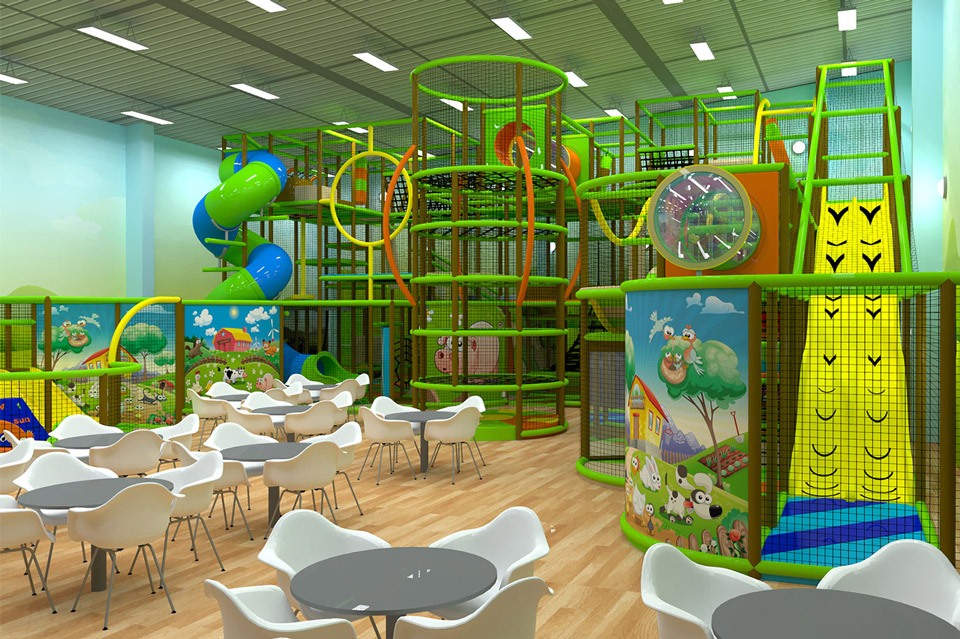 Indoor play area featuring colourful climbing frames, slides, and soft play equipment, with seating for families and children. Brightly decorated with engaging murals and a spacious layout for fun and relaxation.