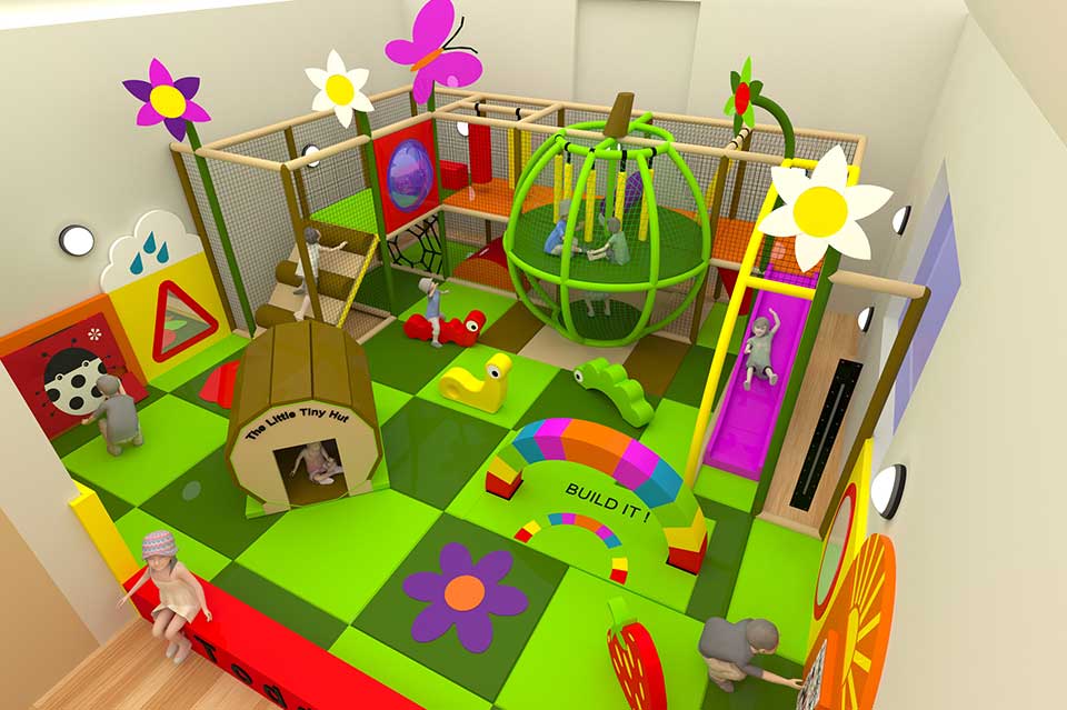Colourful indoor play area featuring various play structures, including a climbing frame, slides, and tunnels, designed for young children. The vibrant design includes flowers, butterflies, and playful shapes, providing an engaging environment for active play and social interaction.