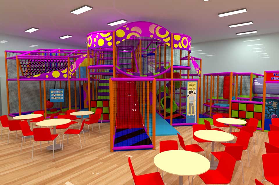 Brightly coloured indoor play area featuring a multi-level climbing frame, slides, and play structures, surrounded by red tables and chairs. Ideal for children's entertainment and socialising.
