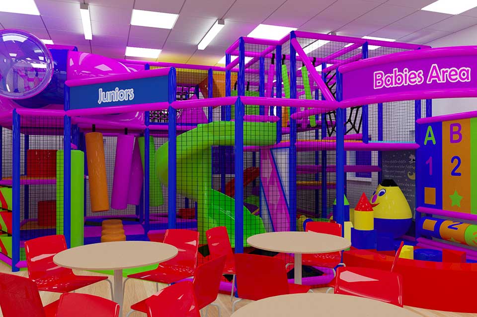 Colourful indoor play area featuring a large climbing frame with slides, tunnels, and soft play equipment, surrounded by red tables and chairs, designed for children's entertainment and physical activity.