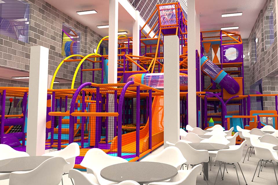 Indoor children's play area featuring vibrant orange and purple climbing structures, slides, and seating areas for parents. Ideal for family outings and children's birthday parties.