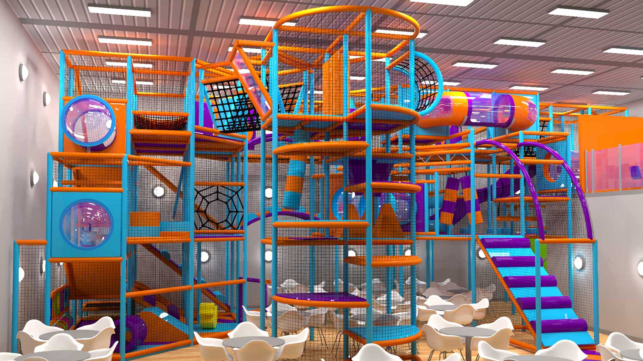 Brightly coloured indoor play area featuring a multi-level climbing frame with slides, tunnels, and netting, designed for children's entertainment and active play.